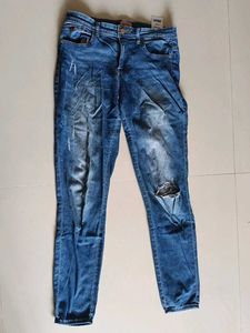 Distressed Blue Denim Jeans