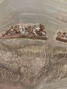 designer blouse piece in soft gold with hand work