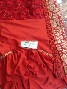 Elegant Red Saree with Gold Embroidery