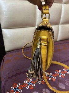 at half rate now mustard hand bag