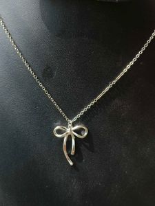 Silver Bow Pendant Necklace