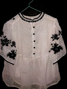 White Top With Wuater Half Sleeves, Can Be Pair With High Waist Jeans. It Can Be Use On Regular Bases