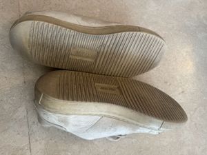 Worn White Sneakers