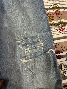 Distressed Denim Jeans