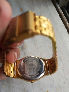 Titan Gold Tonned Oval Shaped Unisex  Watch