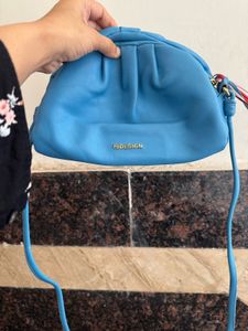 Hidesign sling with leather charm n dust bag
