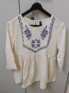 White Embroidered Peplum Top