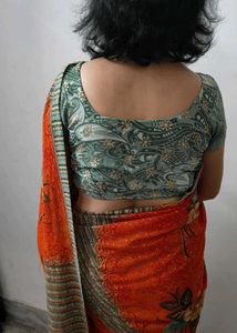 Elegant Orange Printed Saree with Floral and Geome