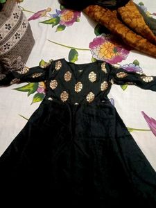 Black Dress with Gold Polka Dot Detail