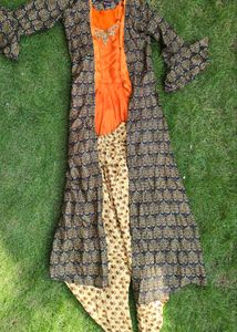 modern pulm top and dhoti along with shrug