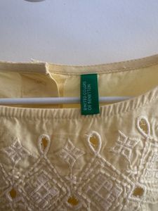 UCB Yellow Solid Styled Back Pure Top