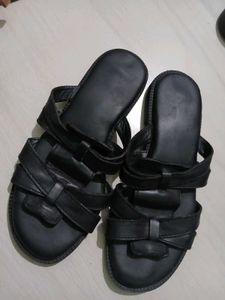 Black leather slides