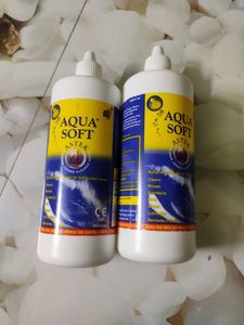 Two Large Bottles Of Aqua Soft Lens Water