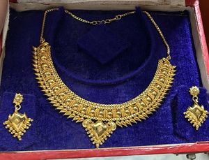Artificia Gold Necklace And Earrings