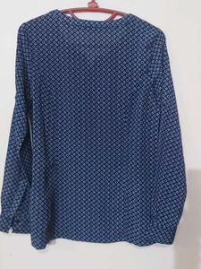 Blue Printed Georgette Top With Fold Up Sleeves.