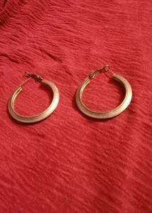 Gold decorative hoop Earrings.