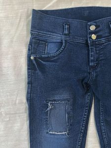 Distressed Patch Denim Jeans