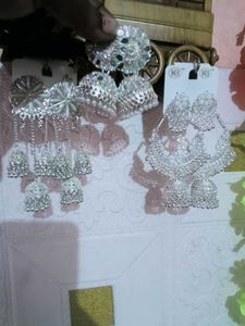 three long Elegant Silver Jhumka Earrings