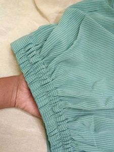 A beautiful sea green coloured crop shirt..