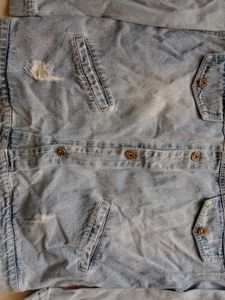 Distressed Blue Denim Jacket With A Touch Of 90s