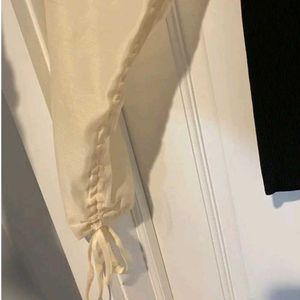 Zara size small black top with cream puffy sleeves