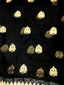 Beautiful Black And Cream Colour Georgette Saree