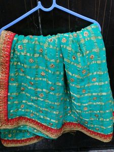 Green Colour Saree With red Lace and Kundan Work On It