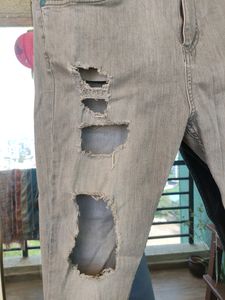 Highly Distressed Jeans In Grey
