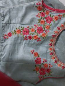 A beautiful grey lehenga with pink detailing