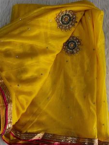 Elegant Yellow Saree with Pearl Details