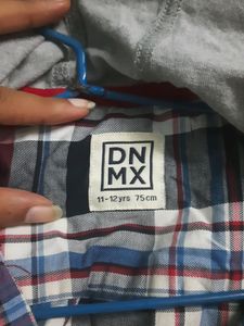 Stylish boys&#39; plaid shirt with an attached hoodie.