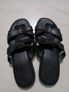 Black leather slides