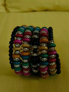 This is a colorful boho-style beaded bracelet stac