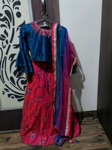 a blue and Rani colour choli lehenga with odni