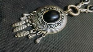 A Black Necklace along With White One