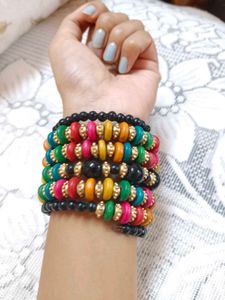 This is a colorful boho-style beaded bracelet stac