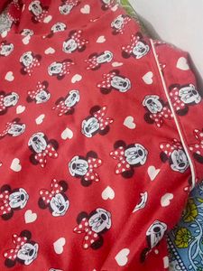 a red night suit gives cozy vibe wth detailings of