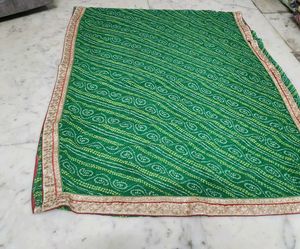 Green bandhni saree with golden border less