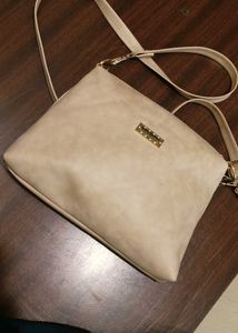 cream colour sling bag