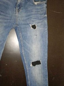 Ripped Knee Jeans