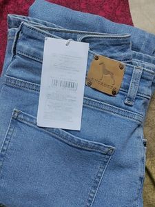full length flared blue jeans