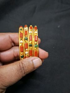 Beautiful coral and gold bangles Sz 2.8