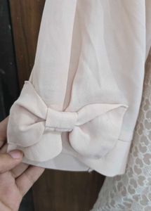 Elegant Cream Lace Panel Top with BowSleeve Detail