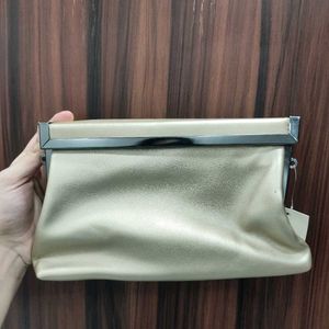 NWT Embelle Gold Cluth With Black Metal Sling