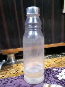 TRANSPARENT BOTTLE WITH STEEL CAP