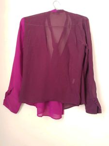 Branded two- tone wrap top.