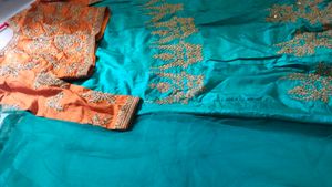 Orange  Blouse With Peacock Green Lehenga