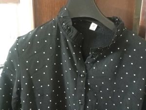Black midi length dress with white dots.