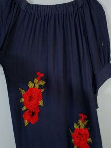 A Beautiful Western Dress With Red Roses