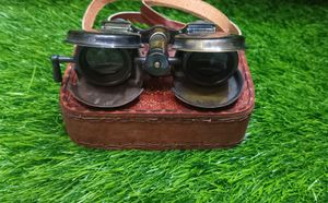 Binocular With A Leather Bag.